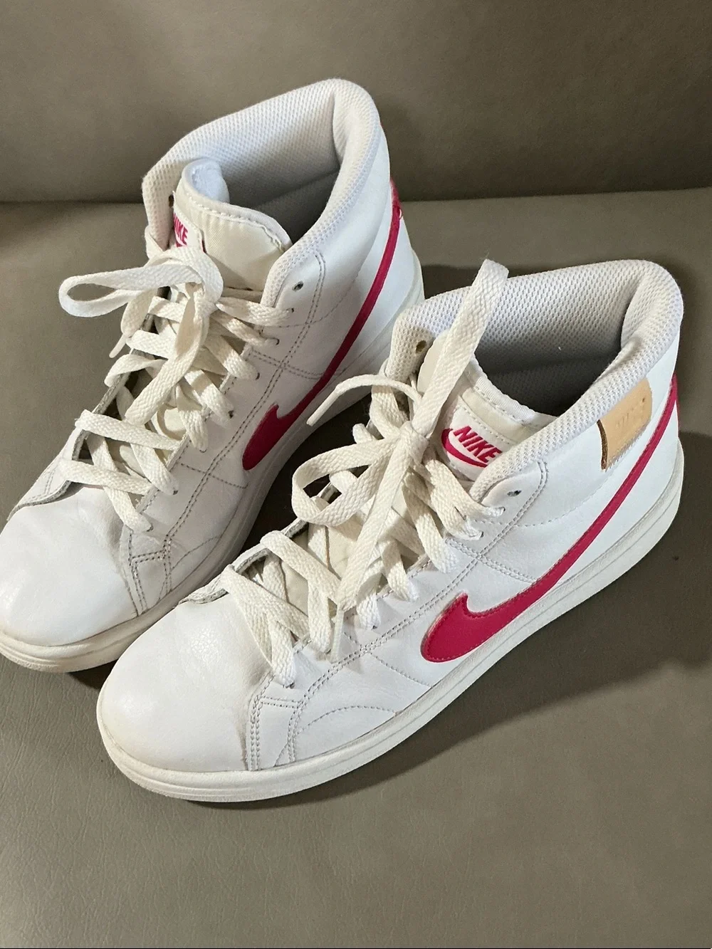 Nike Women's White Sneakers with Pink Swoosh High-Top